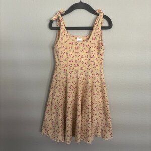Rose and Belle light yellow sundress with pink flowers, ties at shoulders